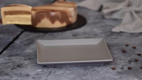 Serving Delicious Caramel and Chocolate Mousse Cake