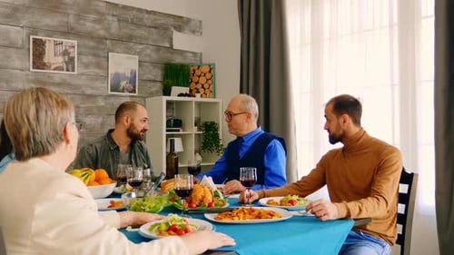 Family Meal at Table in Bright Dining Room