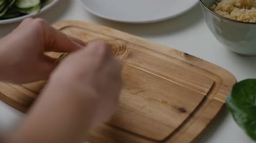 Close-up of Female hands cut an avocado Cooking Salad.