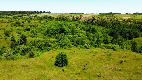 Aerial drone view of a flying over the rural agricultural landscape.