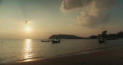 Sunset beach sea view background with boats