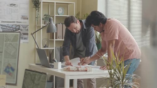 Team of Architects Developing Work Plan in Office