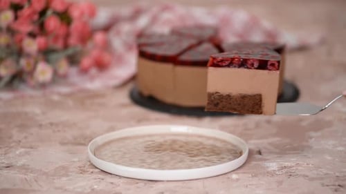 Chocolate Cake Slice with Cherries Being Served