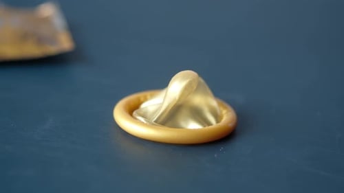 Close Up of Condom on Dark Backgrund
