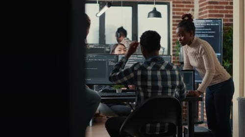 Software Programmers Discussing About Online Cloud Computing While the Rest of the Team Joins