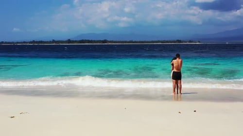 Romantic couple suntan on exotic island beach holiday by blue water and bright sandy background of G