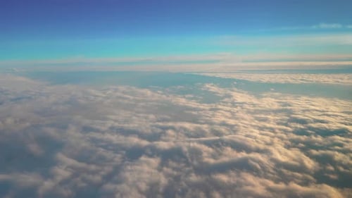 Aerial View of Fluffy Clouds at Sunset