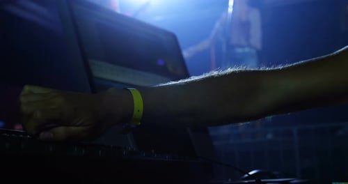 Dj man using sound mixer console at a concert 4k