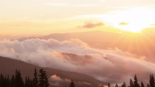 Mountains at Sunrise with Clouds and Golden Light