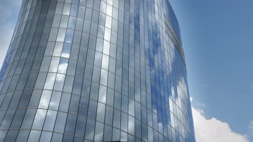 glass skyscraper, business building with clouds in the windows