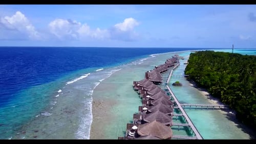 Aerial nature of beautiful seashore beach voyage by blue sea with white sandy background of a dayout