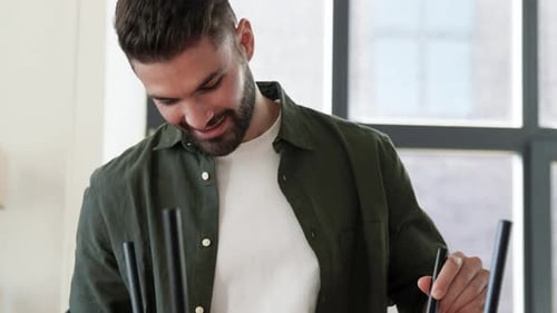 Happy Man Assembling Coffee Table at New Home