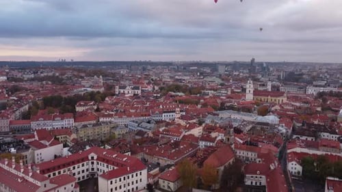 Vilnius Old Town Aerial Cityscape, Tilt Up Revealing Hot Air Balloons
