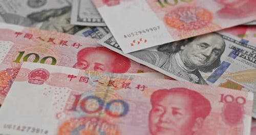 Dollars and Yuan Pile Close Up