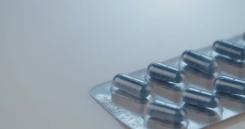 Blue Capsule Pills in Blister Pack Close-Up