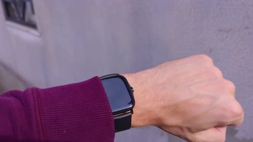 Smart Watch Displaying Digital Time Outdoors