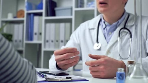 Doctor Talking with Patient in Office