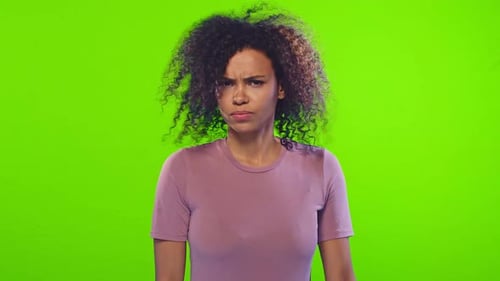 Concerned Woman Shakes Head No on Green Screen