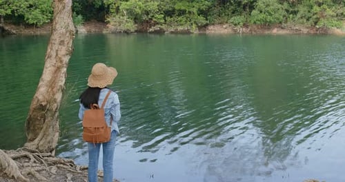 Woman enjoy the view of the lake when hiking