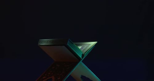 Close Up of Islamic Book on Stand at Night