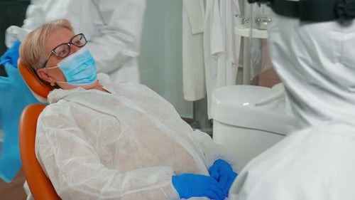 Patient Receives Dental Treatment in Modern Clinic
