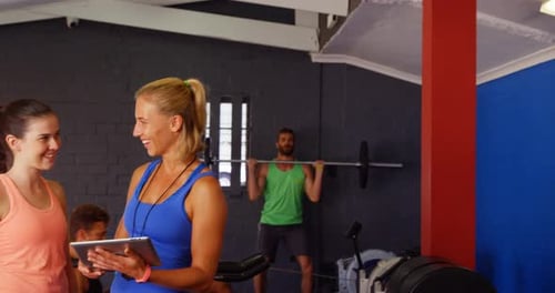 Enthusiastic People Working Out at the Gym