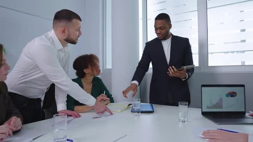 Business Meeting in Modern Office Analyzing Data