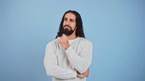 Man with Long Hair Thinking, Light Blue Background