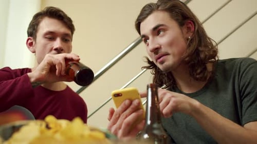 Young Men Enjoying Music and Social Media