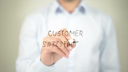 Man Writing Customer Satisfaction with Pen