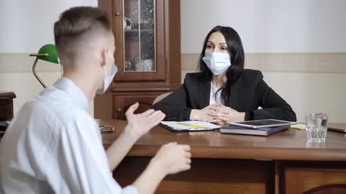 Business Meeting with Face Masks in Office Setting