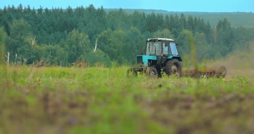 Tractor Plows the Land, Preparing for Sowing. Rural Work in the Field, Beautiful Landscape. , 10Bit