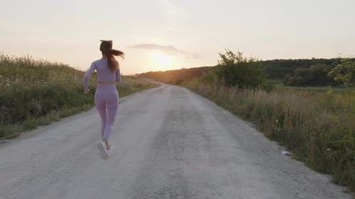 View of a Girl That Running on a Road
