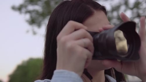 Woman Taking Photo with Digital Camera Outdoors