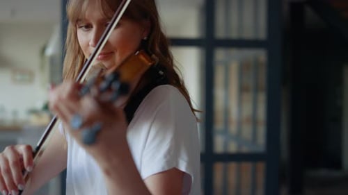 Woman Plays Violin Indoors Close Up