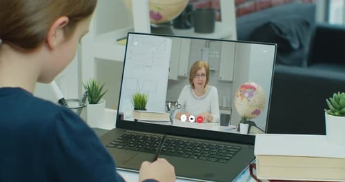 Girl Attends Class From Home on Laptop