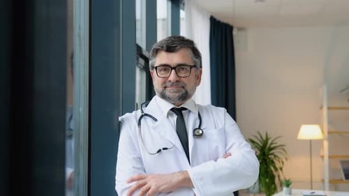Professional Doctor Standing in Office with Arms Crossed