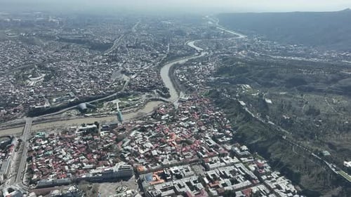 Aerial view of Old Tbilisi in the center of city. Morning cityscape of capital of Georgia 2022