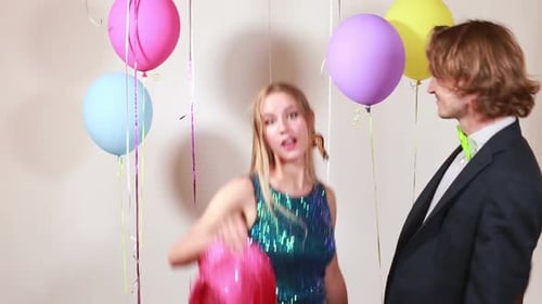 Slow motion of cute couple dancing in photo booth