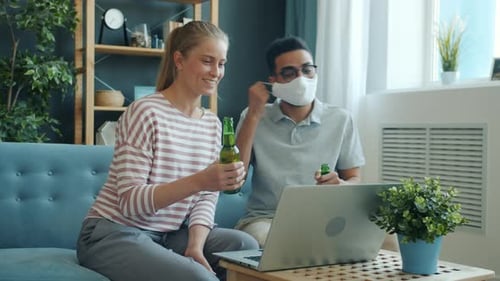 Friends Video Chatting and Drinking Beer at Home