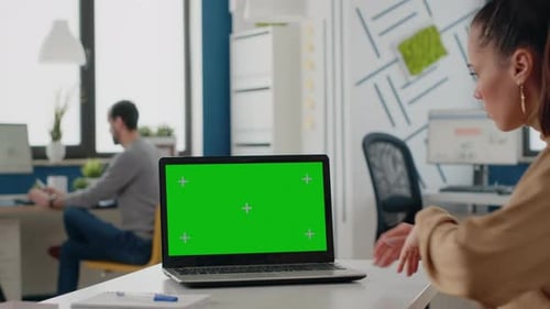 Close Up of Woman Using Green Screen on Laptop
