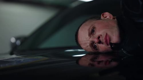 Man Lies on Car as Gun is Pointed at Head