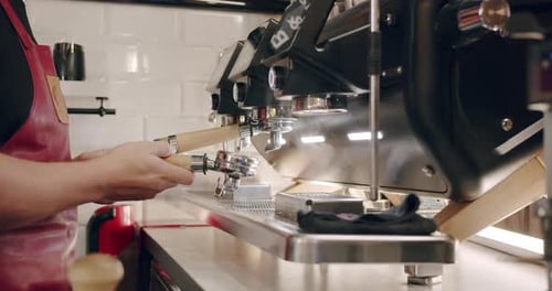 Barista Preparing Espresso on Coffee Machine