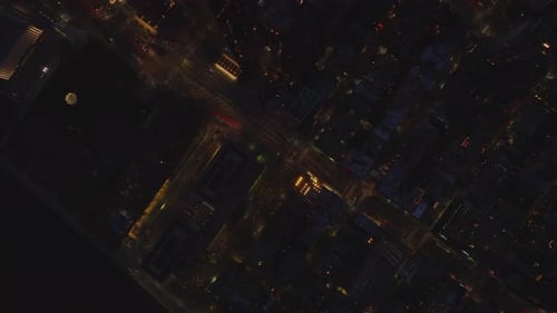 Aerial Birds Eye Overhead Top Down Panning View of Night City