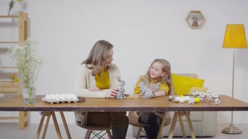 Woman and Girl Making Easter Crafts Together