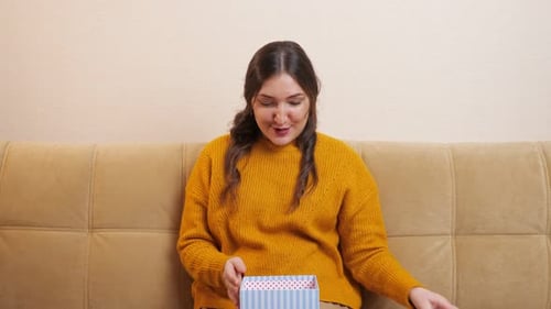 Woman Receiving Gift with Joy and Gratitude