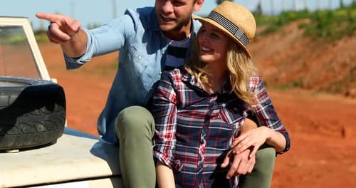 Happy Couple Road Tripping Through the Countryside