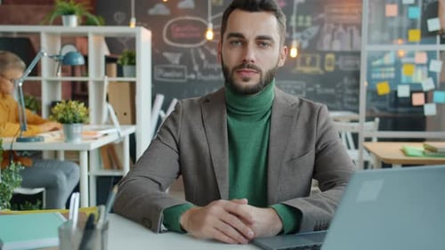 Young Adult Man Portrait in a Modern Workplace