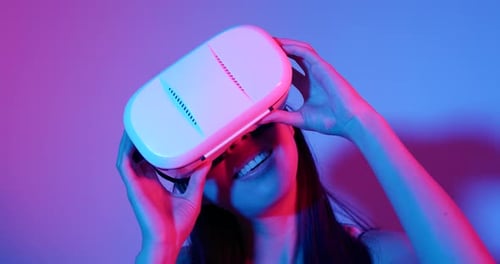 Woman Wearing VR Headset in Red and Blue Light