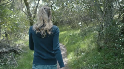 Girl Hiking In The Forest